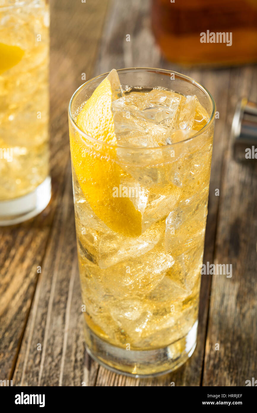 Homemade Whiskey Highball with Soda Water and Lemon Stock Photo