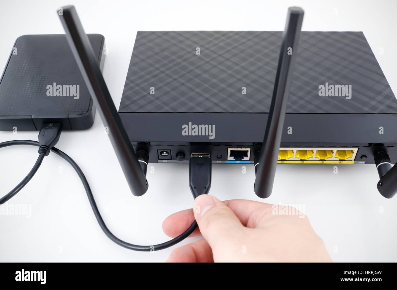 Router with backup storage disk. DLNA media server from USB disk Stock Photo