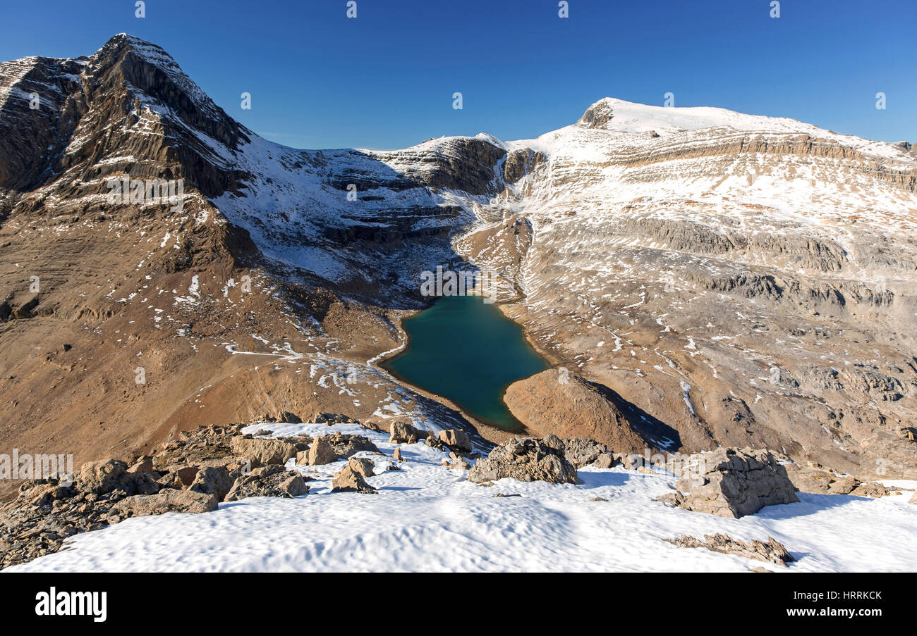 Aerial Landscape View Emerald Green Alpine Lake and Rugged Mountain Peaks above Kiwetinok Pass. Rock Climbing, Yoho National Park, Canadian Rockies Stock Photo