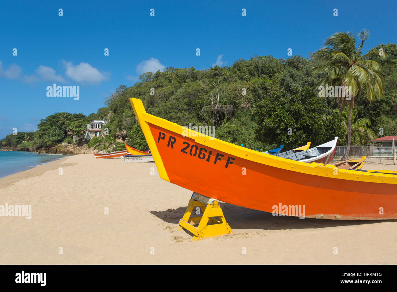 ROW OF BRIGHTLY PAINTED YOLA FISHING BOATS CRASH BOAT BEACH AGUADILLA