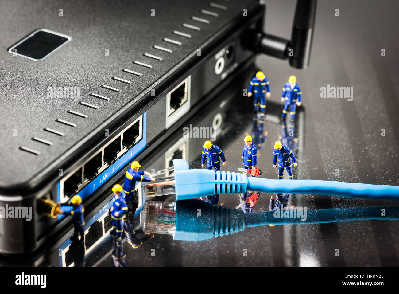 Miniature Network Engineers At Work. Technology concept.Macro photo Stock Photo