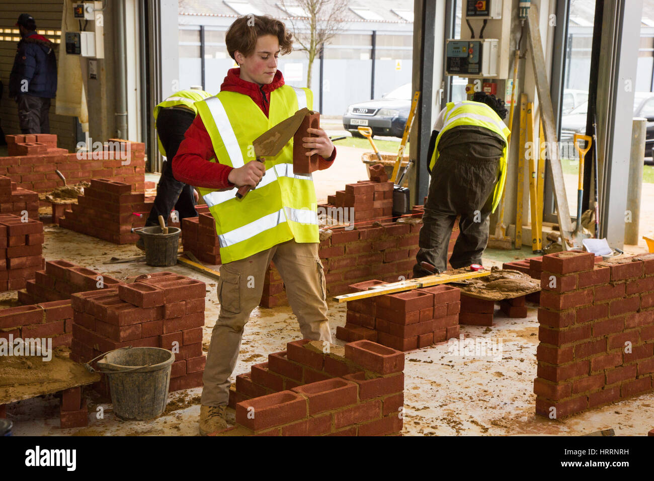 Apprentice builders learning how to construction skills Stock Photo