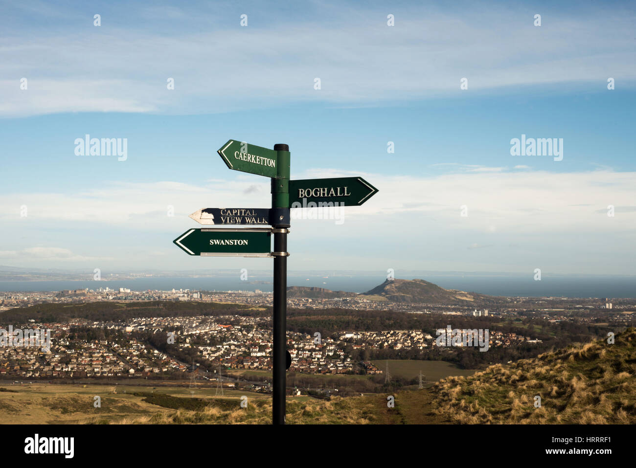 sign post at hillend edinburgh with arthurs seat in background. places are boghall swanston capital view walk Stock Photo