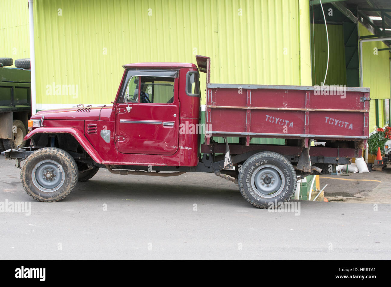 A truck used for hauling coffee beans is parked outside of a coffee facility located in San Marcos, Costa Rica. Stock Photo