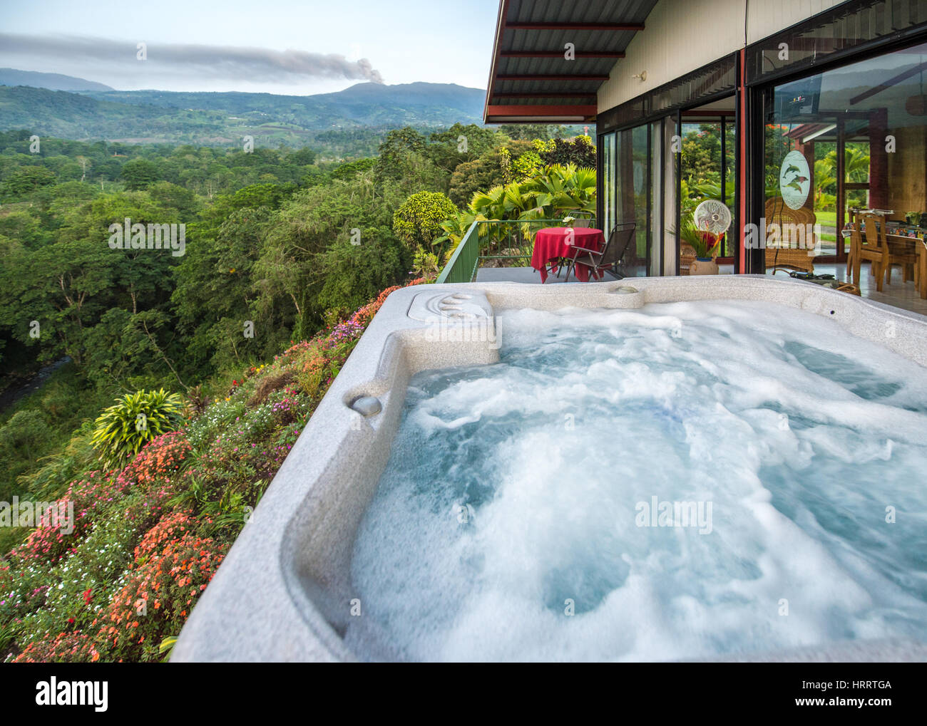 View of View from the hot tub of a small hillside vacation home, where the lush ...