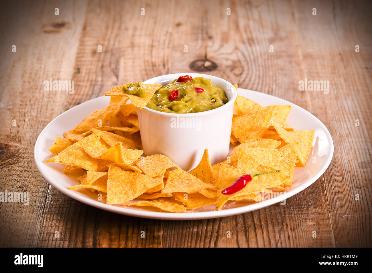 Guacamole dip and nacho chips Stock Photo Alamy