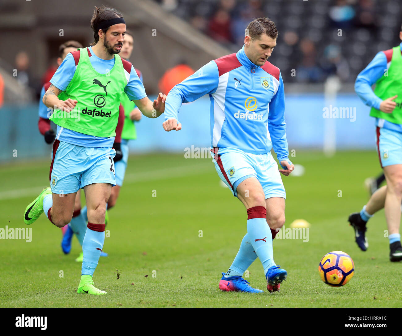 Burnley's George Boyd (left) and Sam Vokes during the Premier League match at the Liberty Stadium, Swansea. PRESS ASSOCIATION Photo. Picture date: Saturday March 4, 2017. See PA story SOCCER Swansea. Photo credit should read: Adam Davy/PA Wire. RESTRICTIONS: No use with unauthorised audio, video, data, fixture lists, club/league logos or 'live' services. Online in-match use limited to 75 images, no video emulation. No use in betting, games or single club/league/player publications. Stock Photo