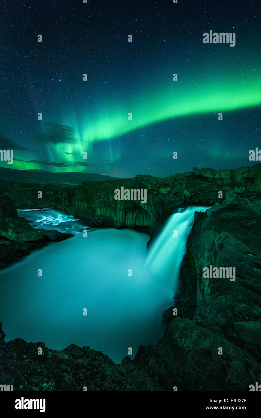 Aldeyjarfoss waterfall at night under the light of Aurora Borealis northern lights, Iceland Stock Photo
