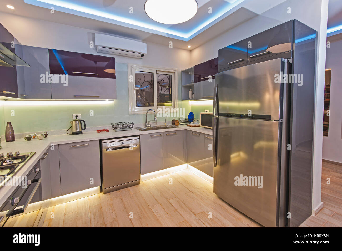 Interior design decor showing modern kitchen and appliances in luxury apartment showroom Stock Photo