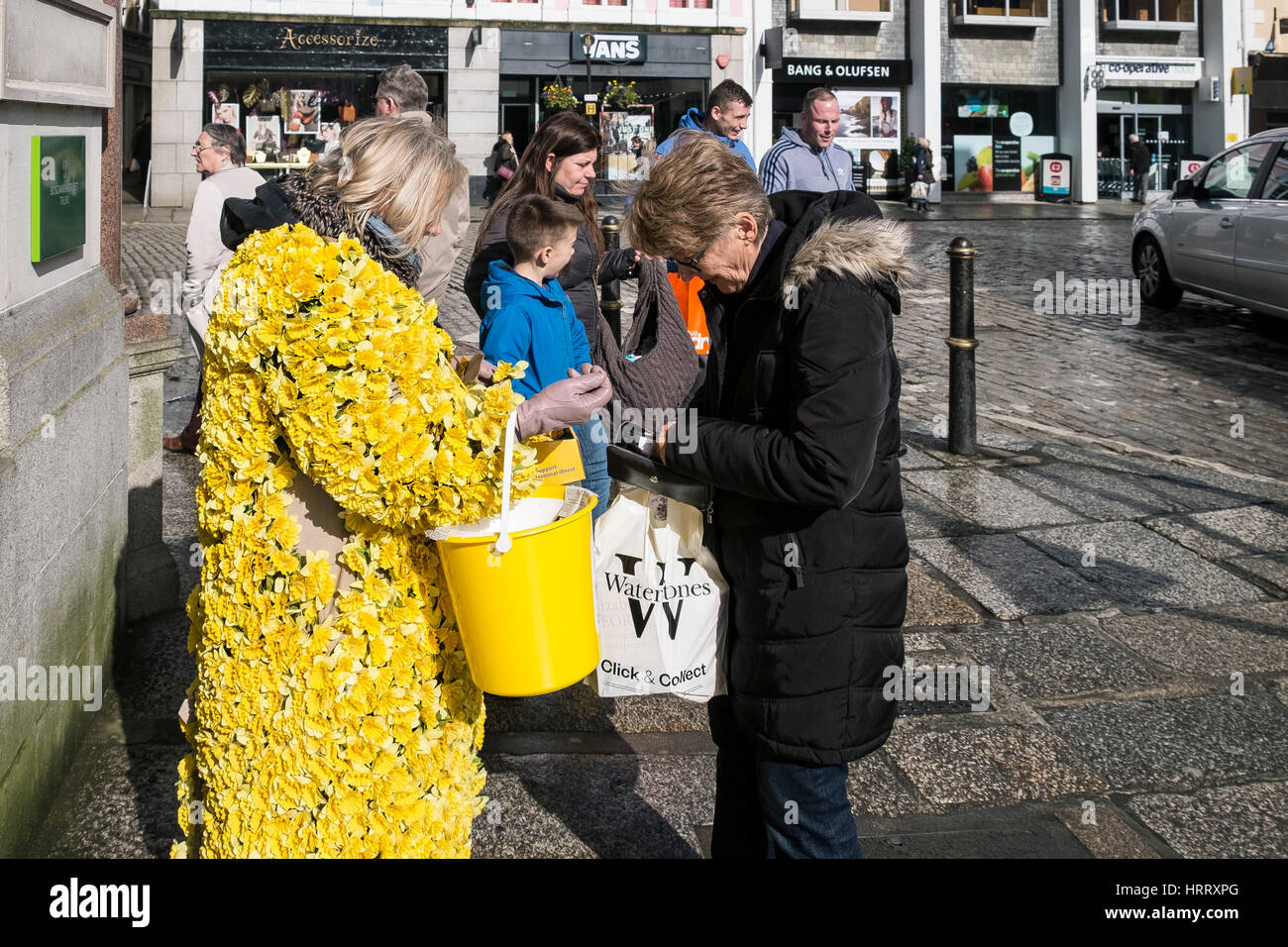 Marie Curie Charity Daffodil Appeal woman daffodils collecting