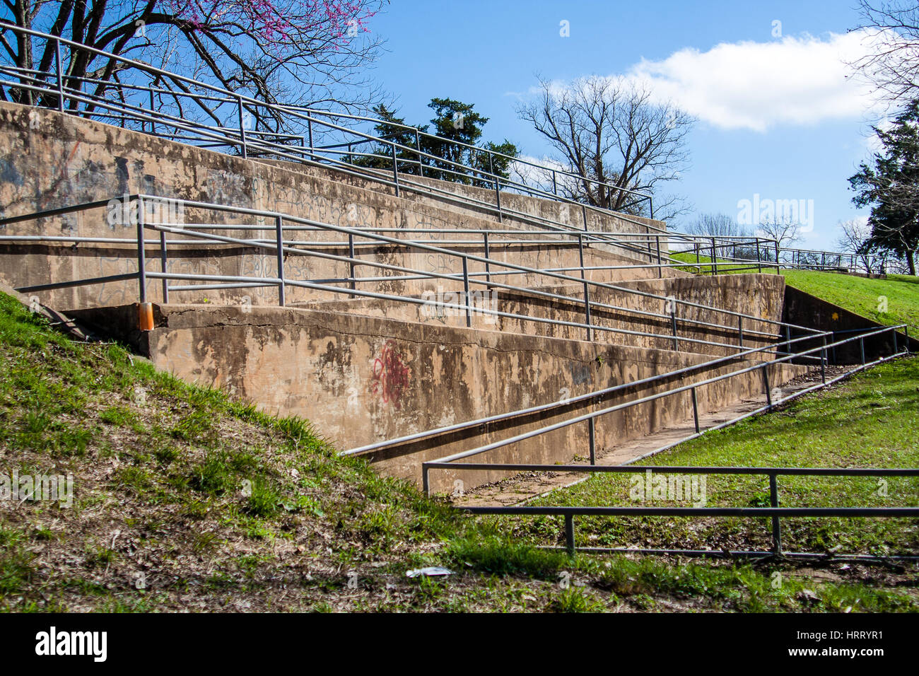 Winding ramp at riverfront park leading down to the Colorado River in Wharton, Texas Stock Photo