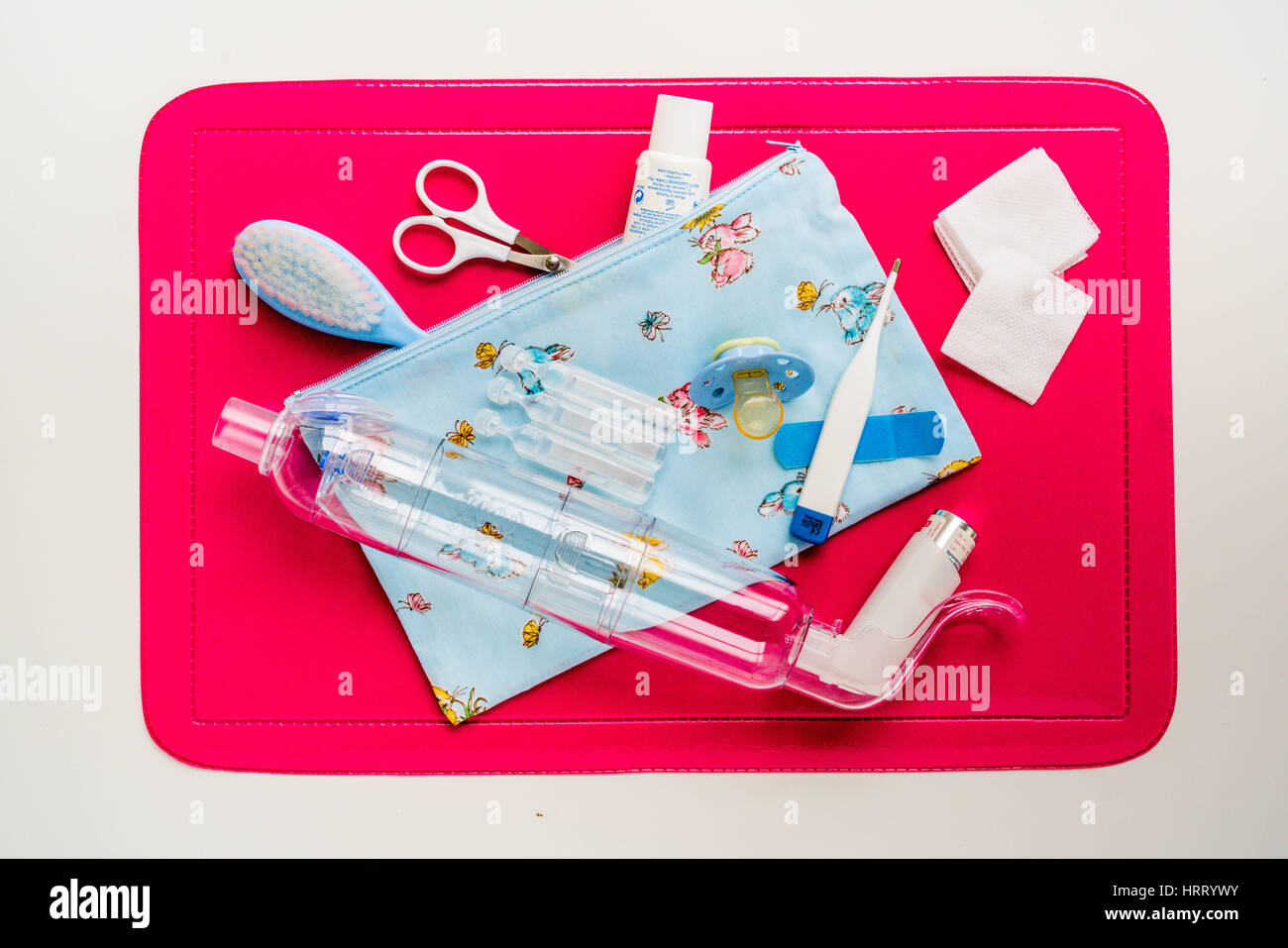 Treatment of asthma for a baby , bronchodilator aerosol with inhalation chamber. Stock Photo