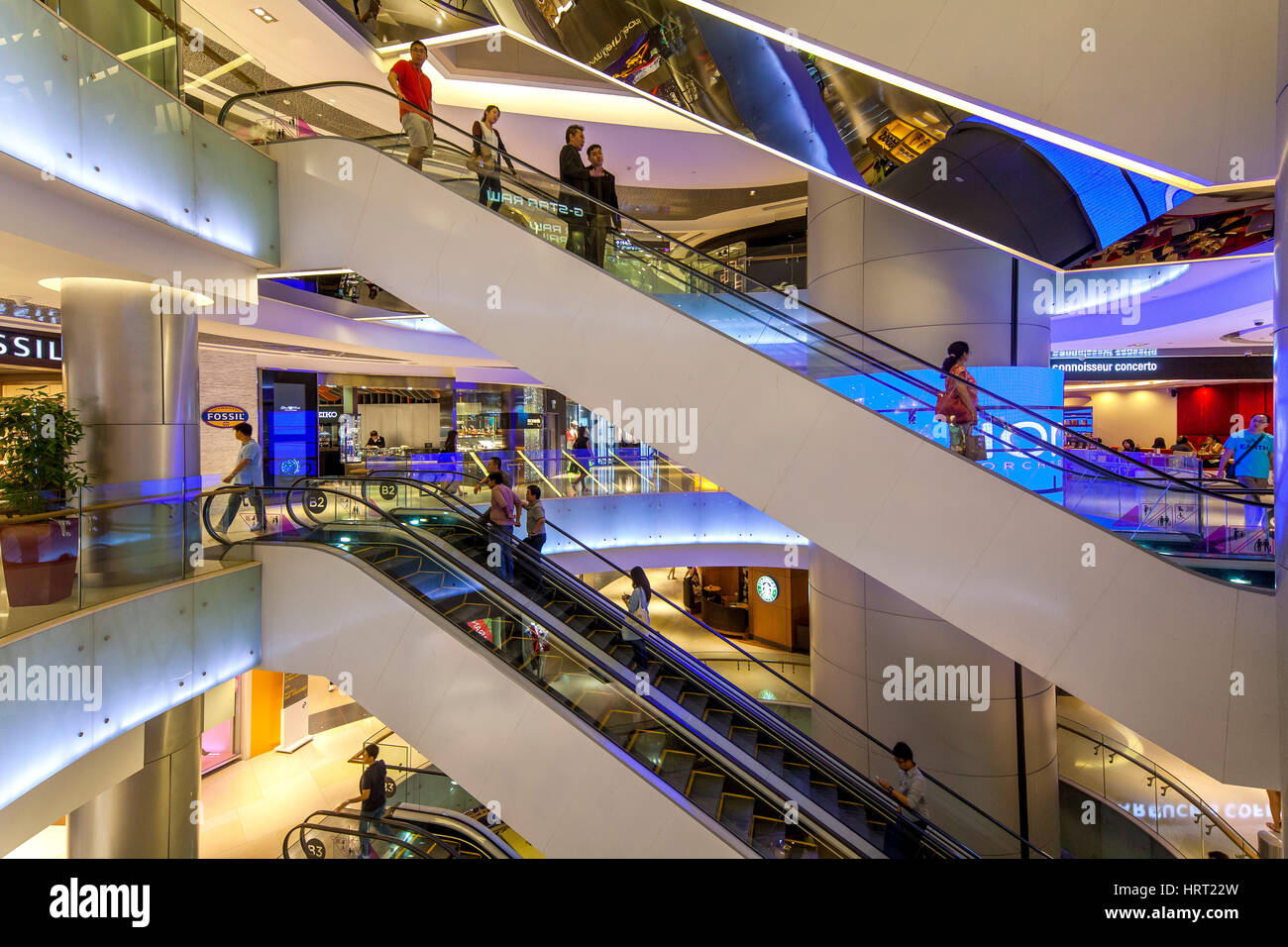 Tourists and locals shopping in a shopping center, escalators, Ion Orchard Mall, Orchard Road, Singapore, Asia, Singapore Stock Photo