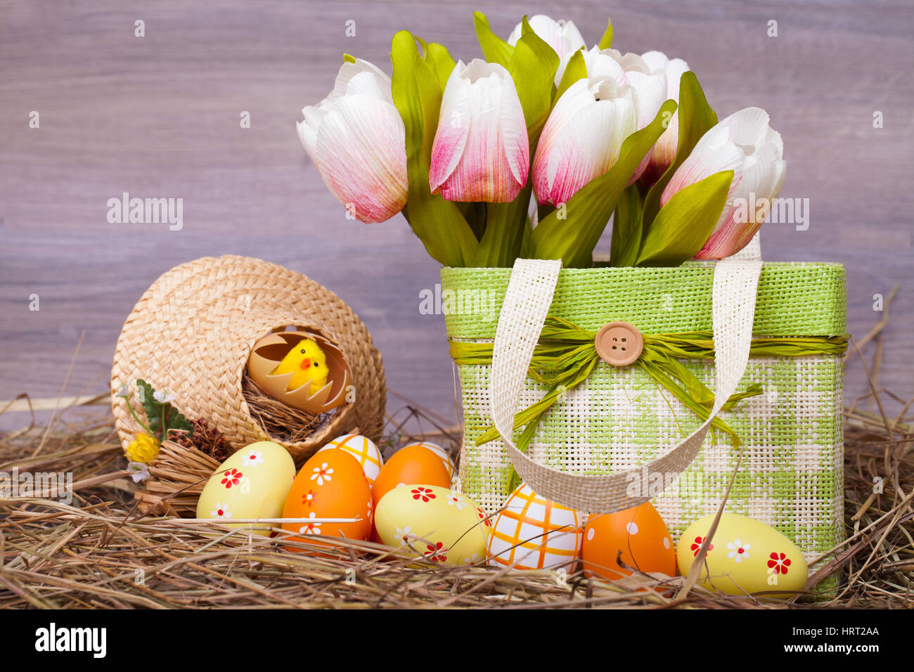 Easter decoration with eggs on a wooden background Stock Photo - Alamy