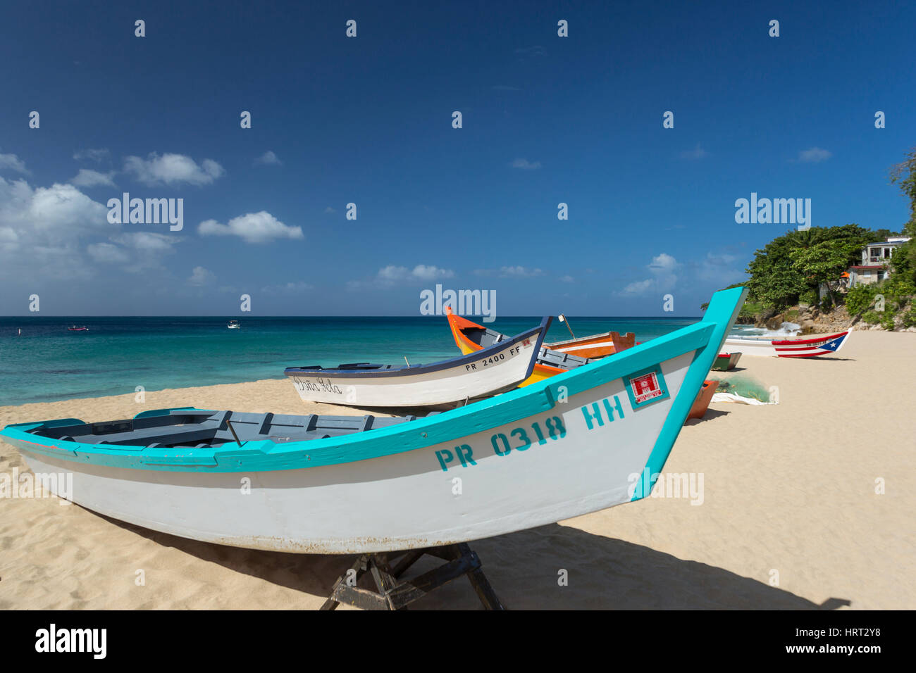 cROW OF BRIGHTLY PAINTED YOLA FISHING BOATS CRASH BOAT BEACH AGUADILLA