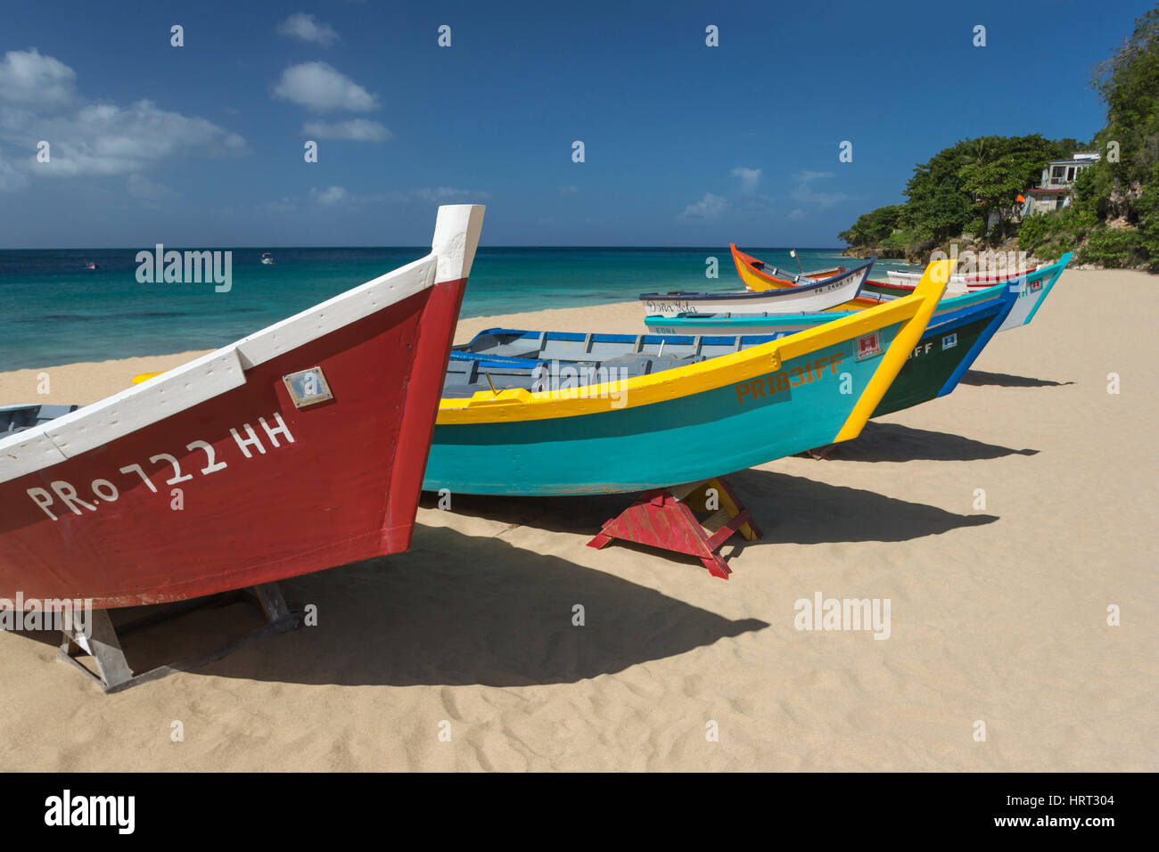 ROW OF BRIGHTLY PAINTED YOLA FISHING BOATS CRASH BOAT BEACH AGUADILLA