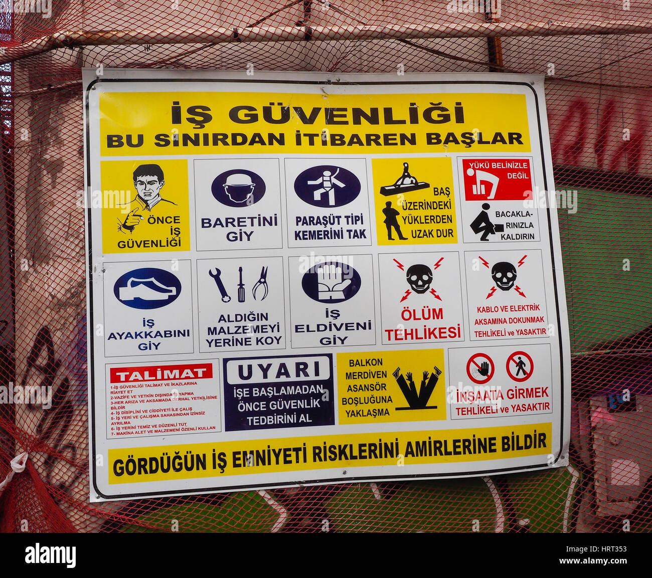 HEALTH AND SAFETY  SIGN WRITTEN IN TURKISH WARNING OF DANGERS ON BUILDING SITE ISTANBUL TURKEY. Stock Photo