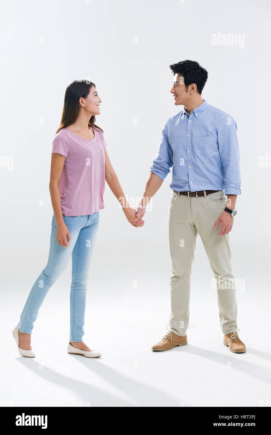 Shot indian couple holding hands hi-res stock photography and images ...