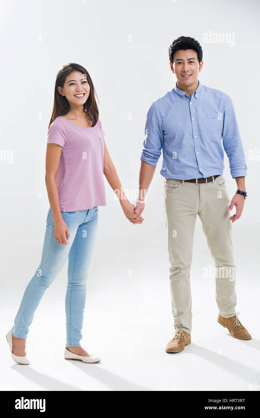 Shot indian couple holding hands hi-res stock photography and images ...