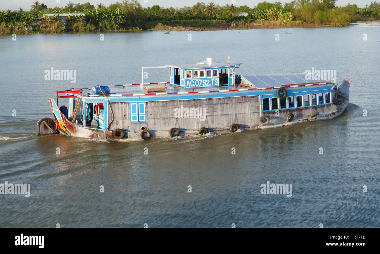 Traditional boat carrying cargo, Mekong river, Vietnam Stock Photo