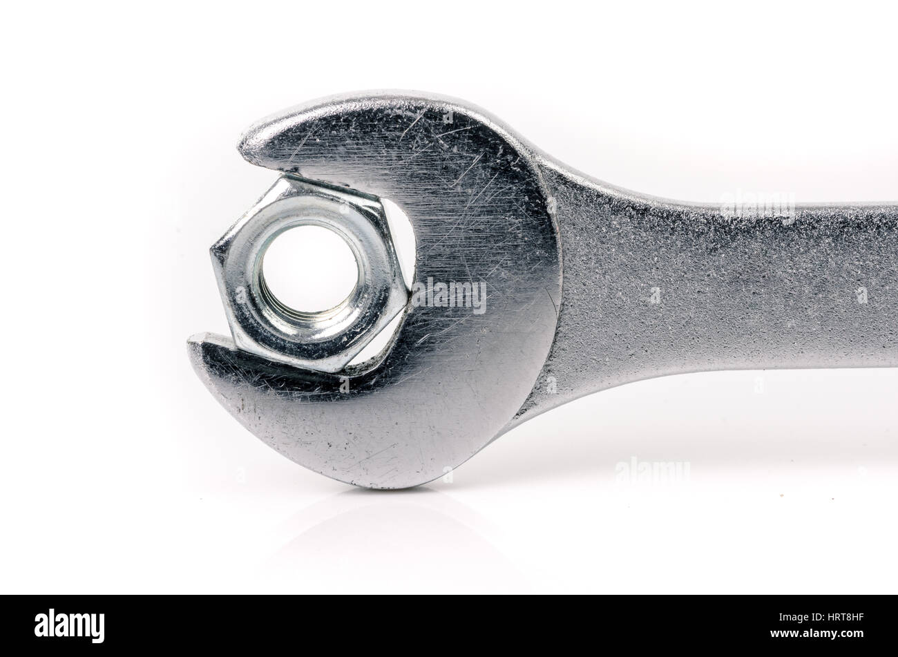 Wrench and nut on white background Stock Photo - Alamy