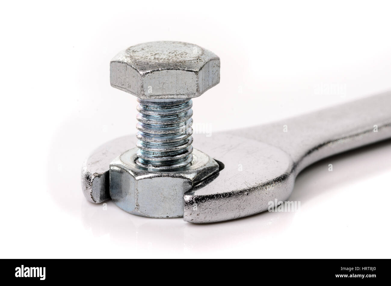 Wrench with nut and bolt on white background Stock Photo - Alamy