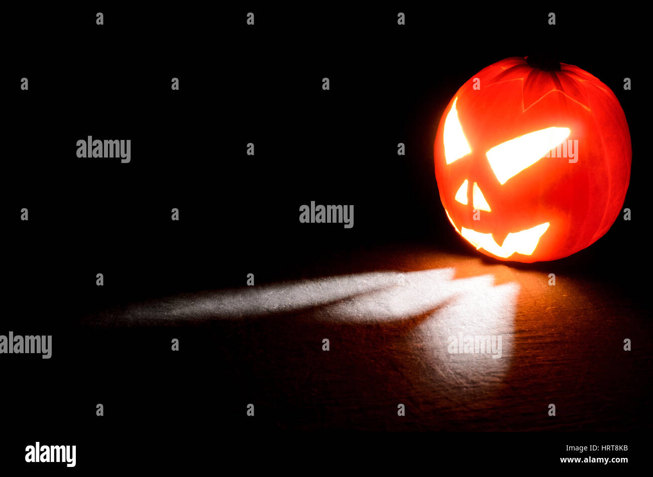 Halloween pumpkin illuminated on black background Stock Photo - Alamy