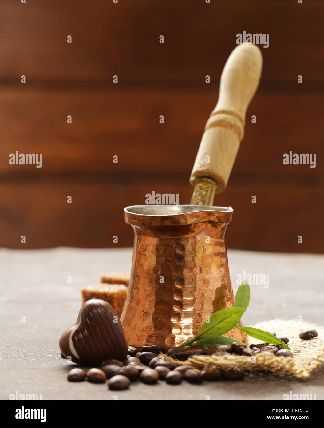 copper cezve coffee and grains on a steel background Stock Photo - Alamy