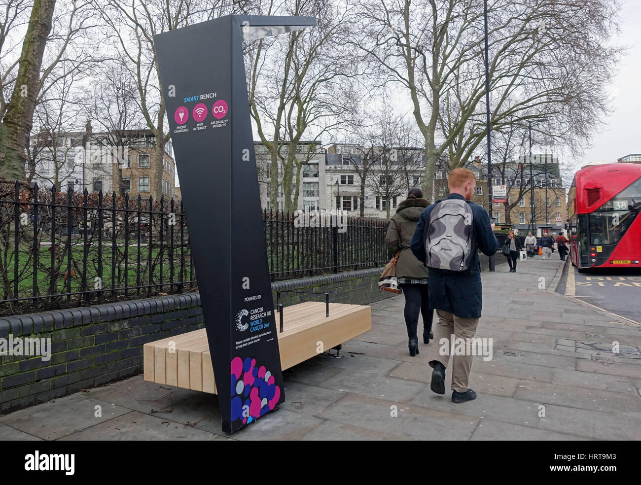 Public solar-powered 'smart bench' for charging mobile devices, Islington, London Stock Photo
