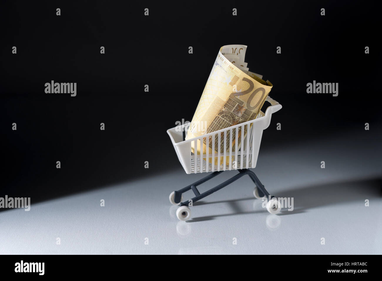 200 Euro banknotes / bills in shopping cart - representing EU economy and retail sales. Stock Photo