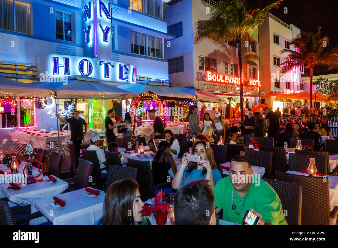 Florida South,Miami Beach,Ocean Drive,Colony Hotel,al fresco sidewalk outside outdoors tables,dining,restaurant restaurants food dining eating out caf Stock Photo
