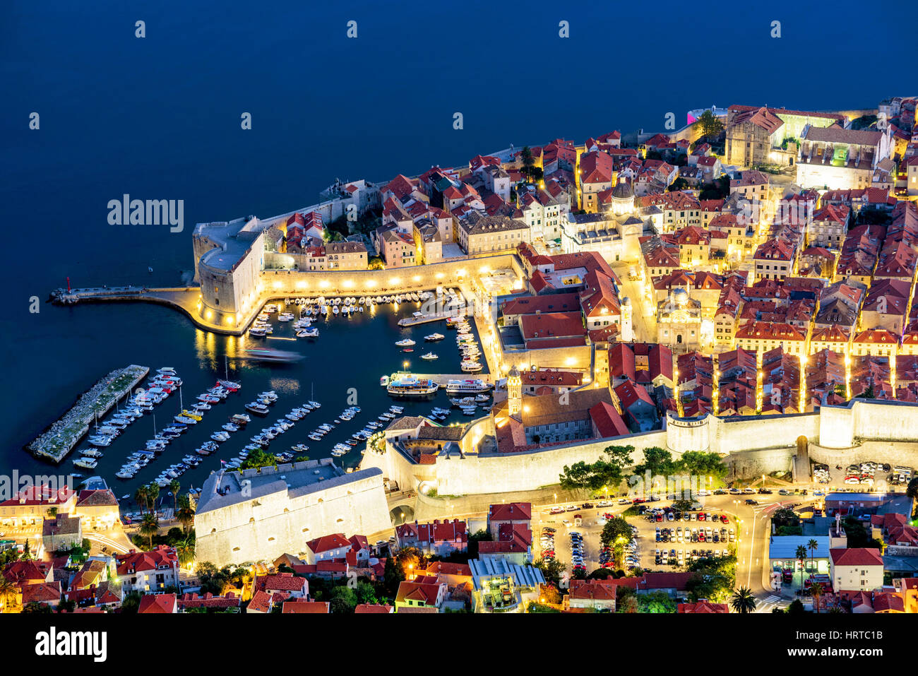 Aerial view of Dubrovnik old town with harbor at night Stock Photo