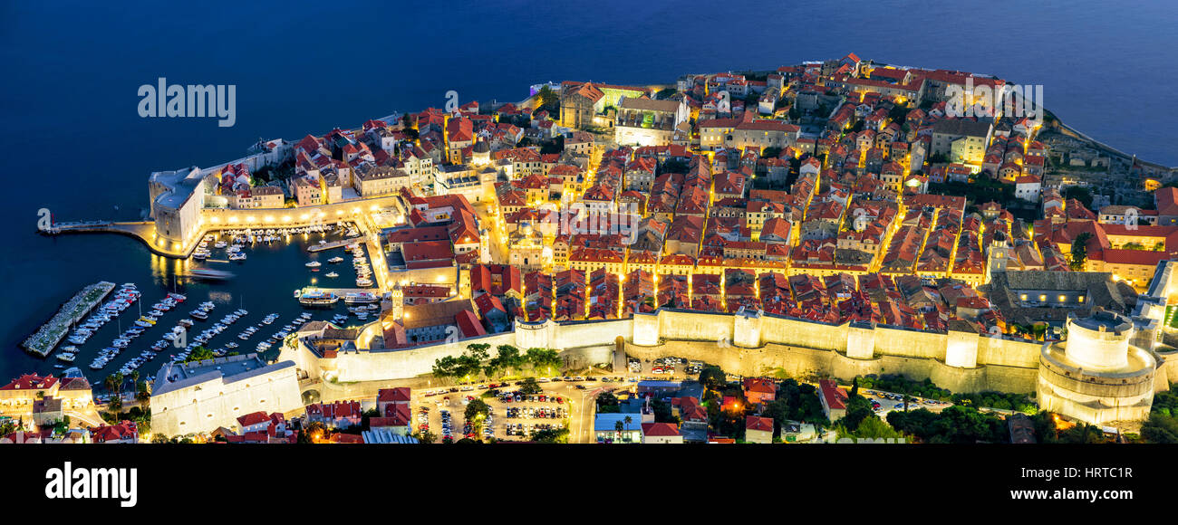 Panoramic aerial view of Dubrovnik old town and harbor at night Stock Photo