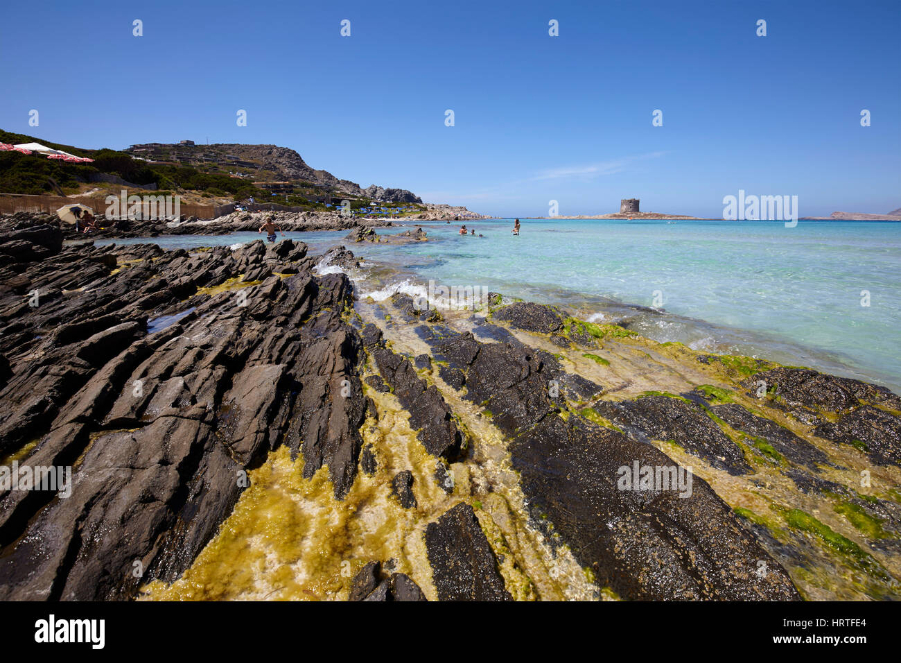 The sea in Stintino with La Pelosa tower, Sardinia, Italy Stock Photo