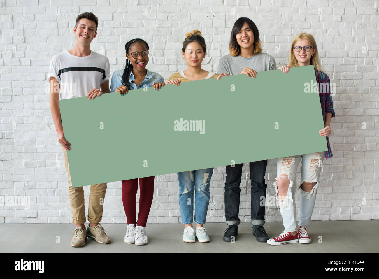 Group of Friends Holding Blank Banner Stock Photo - Alamy