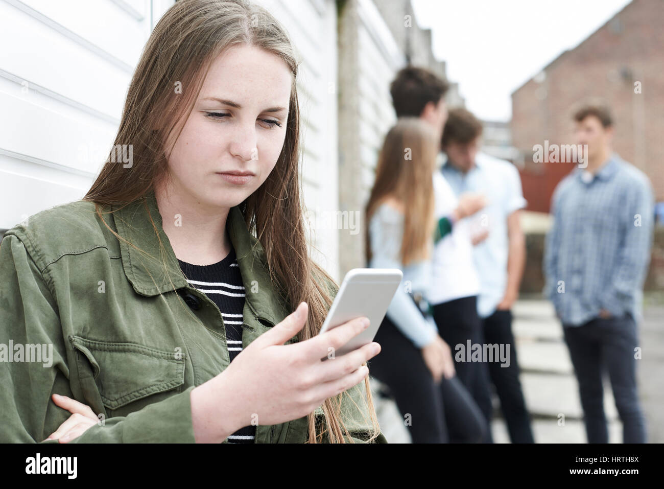 Teenage Girl Victim Of Bullying By Text Messaging Stock Photo