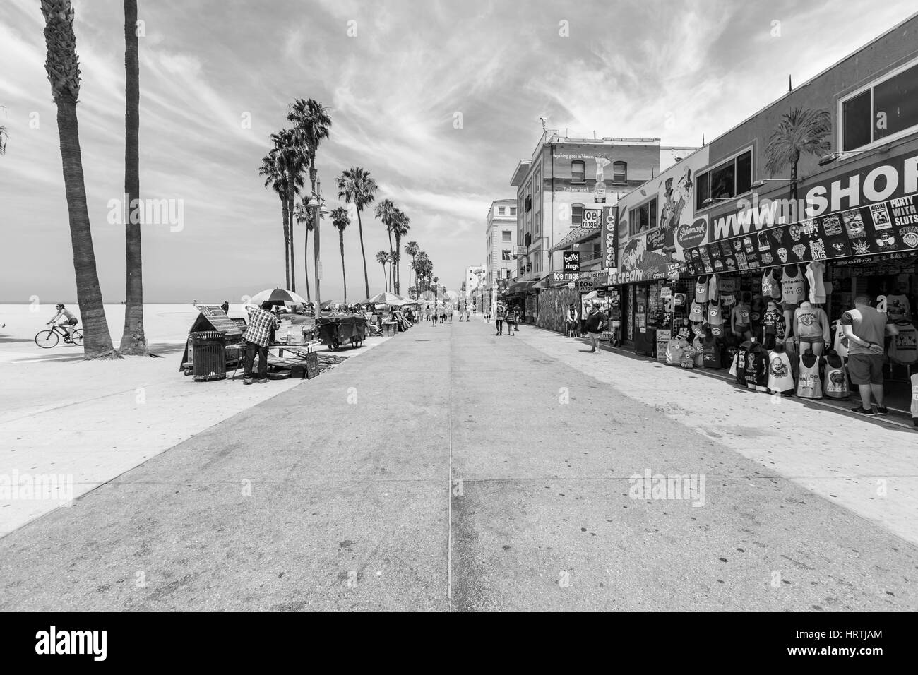 Los Angeles, California, USA - June 20, 2014:  Editorial black and white photo of famously funky Venice Beach board walk in Los Angeles. Stock Photo