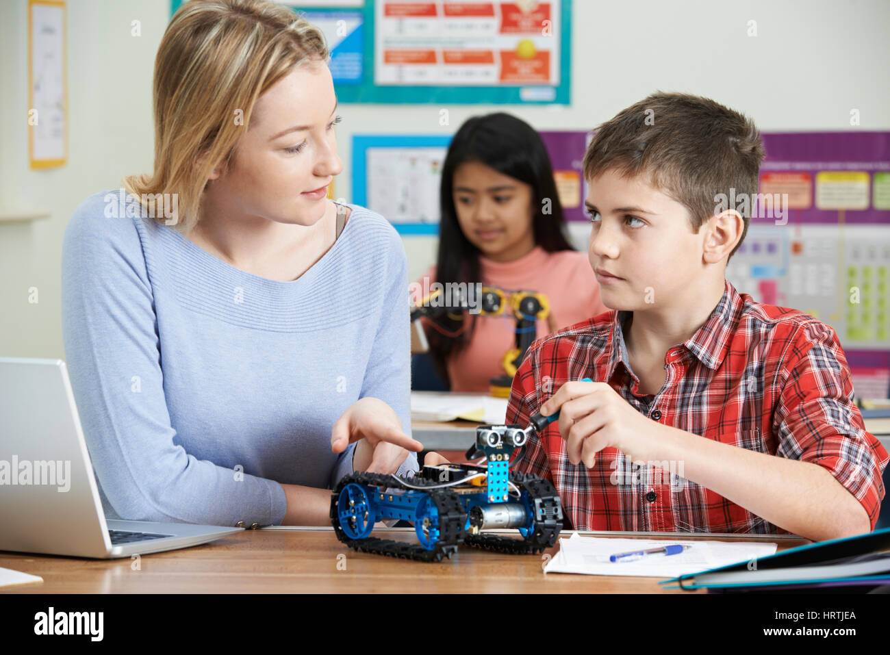 Teacher With Pupils In Science Lesson Studying Robotics Stock Photo