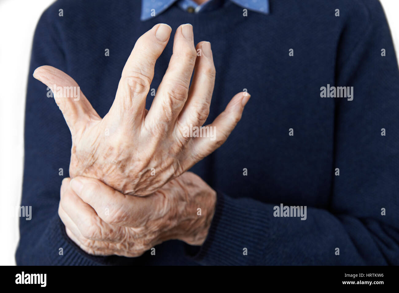 Close Up Of Senior Man Suffering With Arthritis Stock Photo