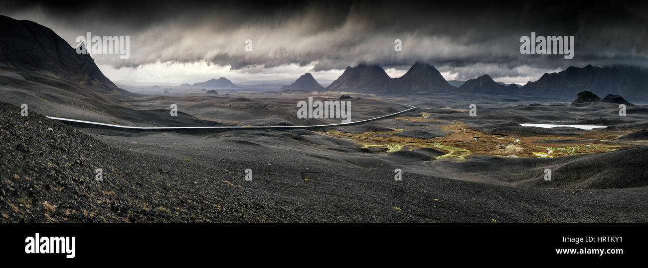 Myvatn, Iceland - Panorama of long road through vast stormy volcanic landscape Stock Photo