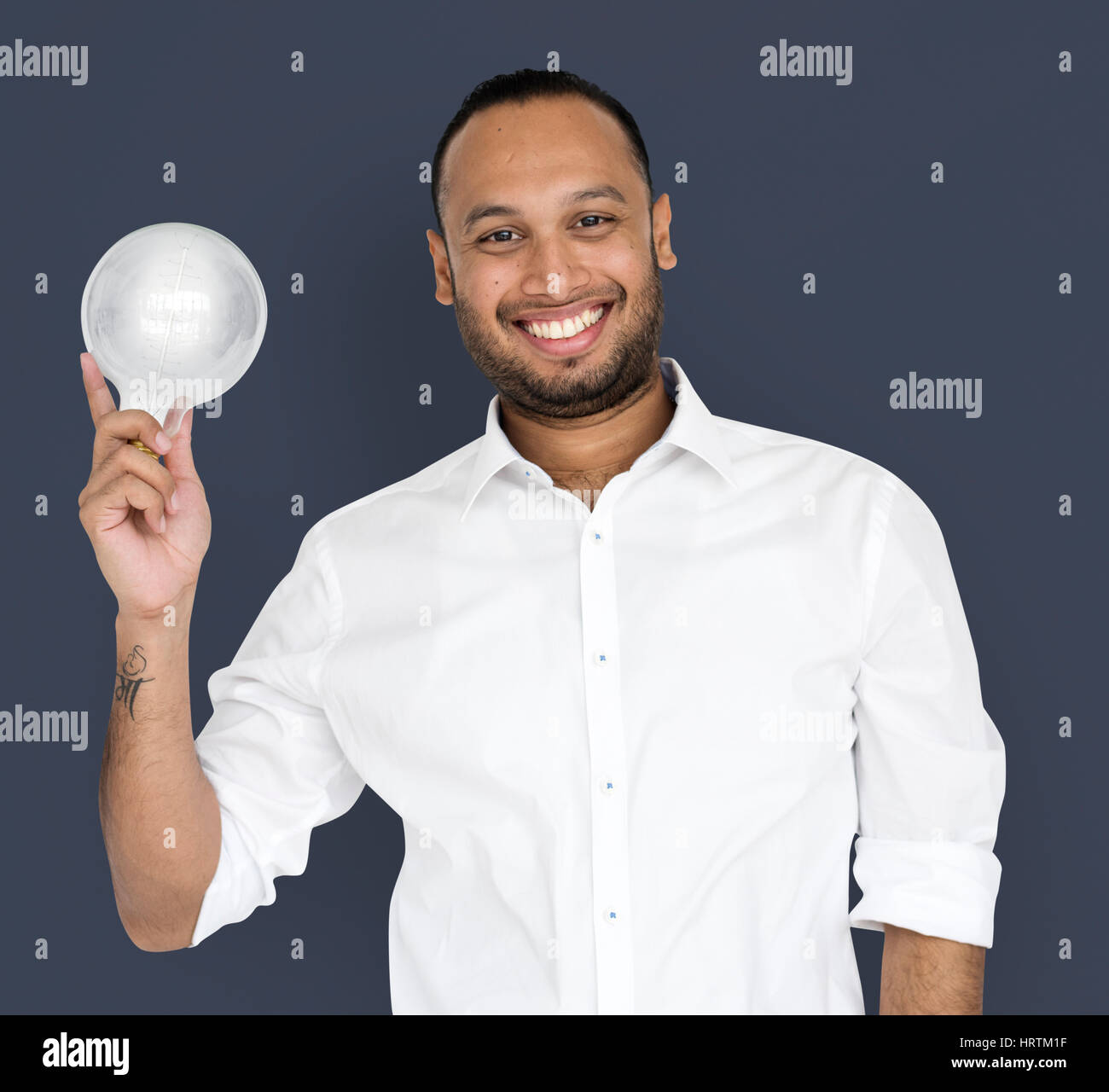 Indian Business Man Smiling Light Bulb Stock Photo Alamy indian-business-man-smiling-light-bulb-stock-photo-alamy