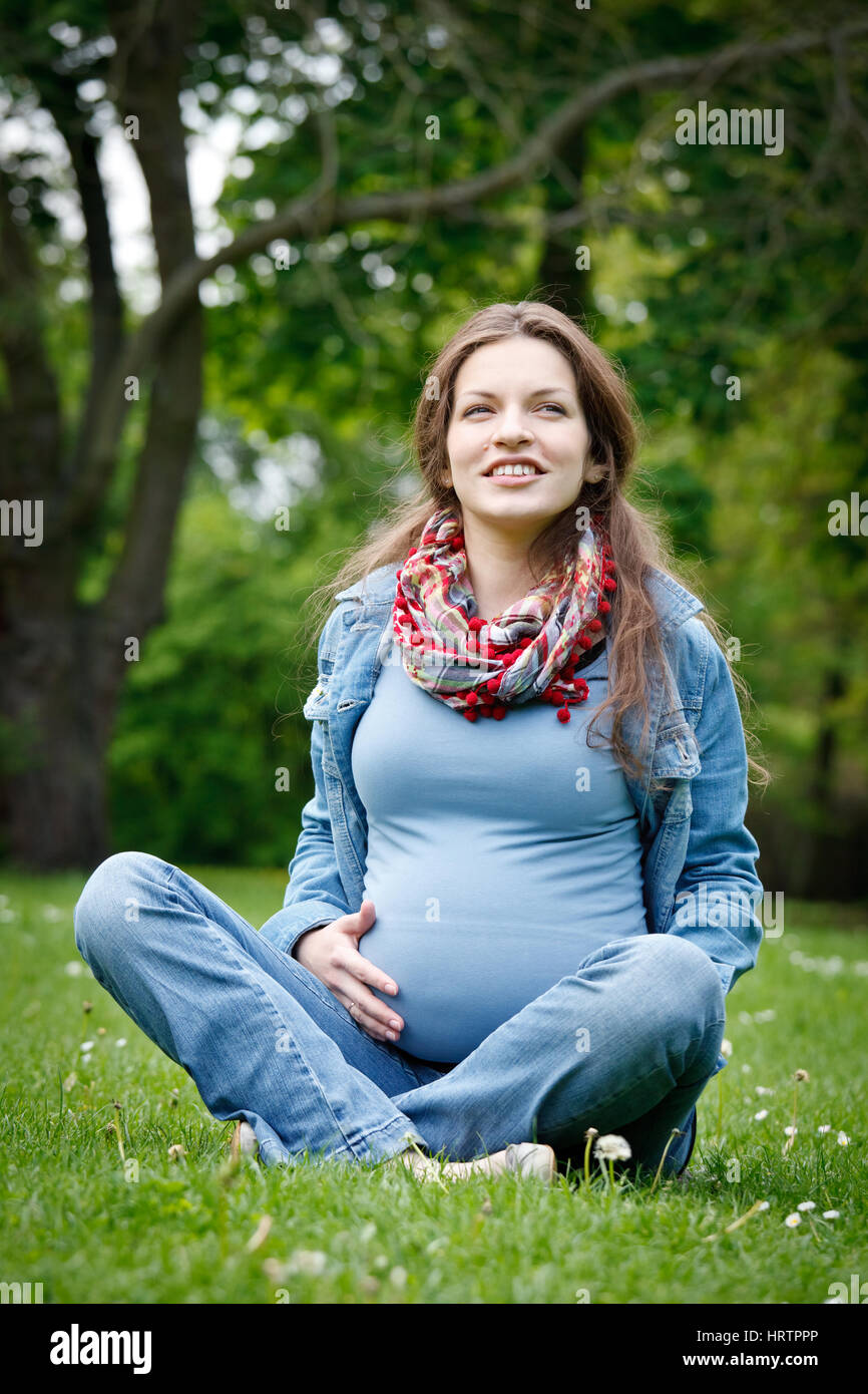 Beautiful pregnant woman in the park Stock Photo - Alamy