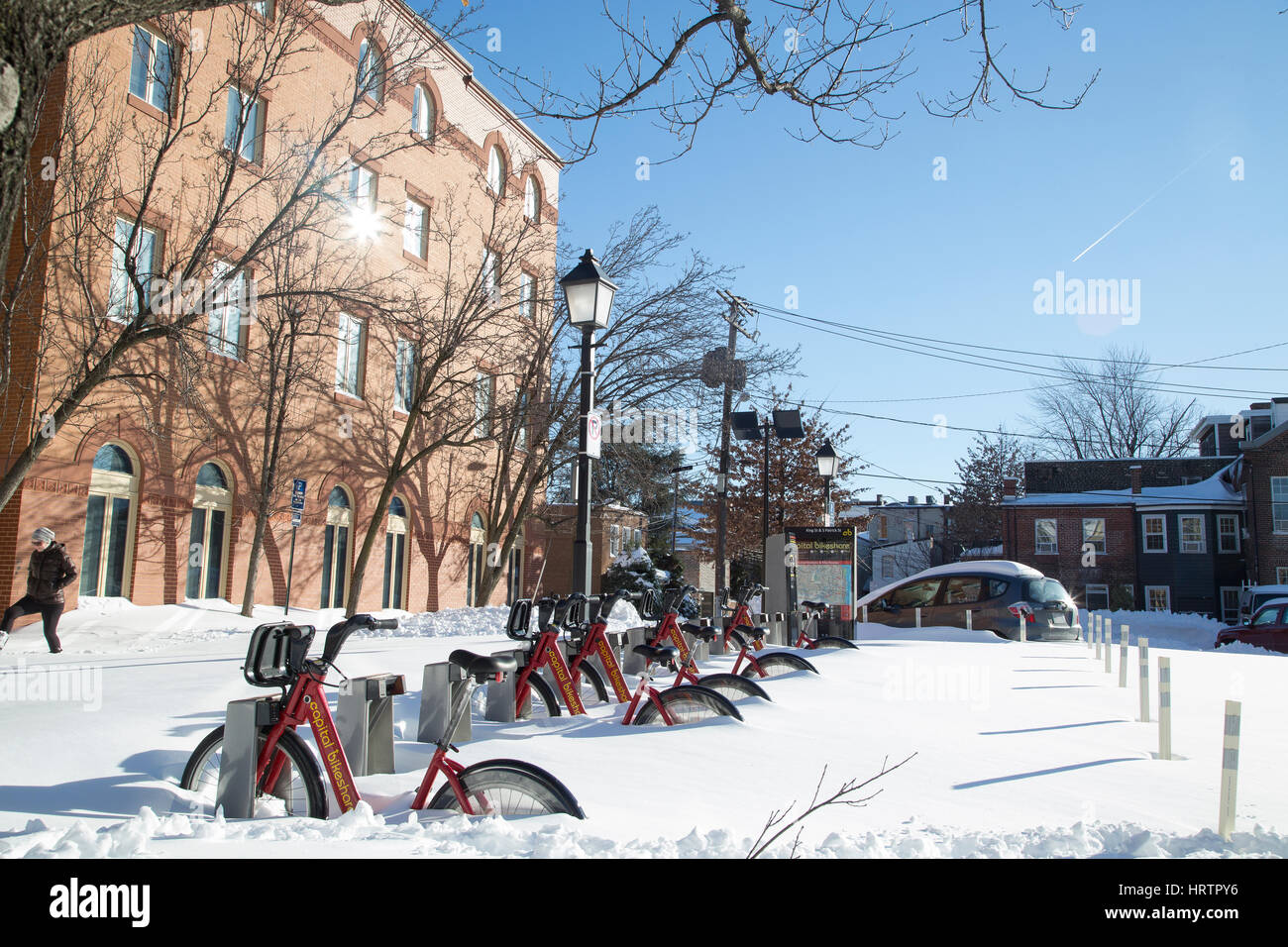 Snow-covered bikes parked after a snowstorm in Alexandria, Virginia. January 2016. Stock Photo