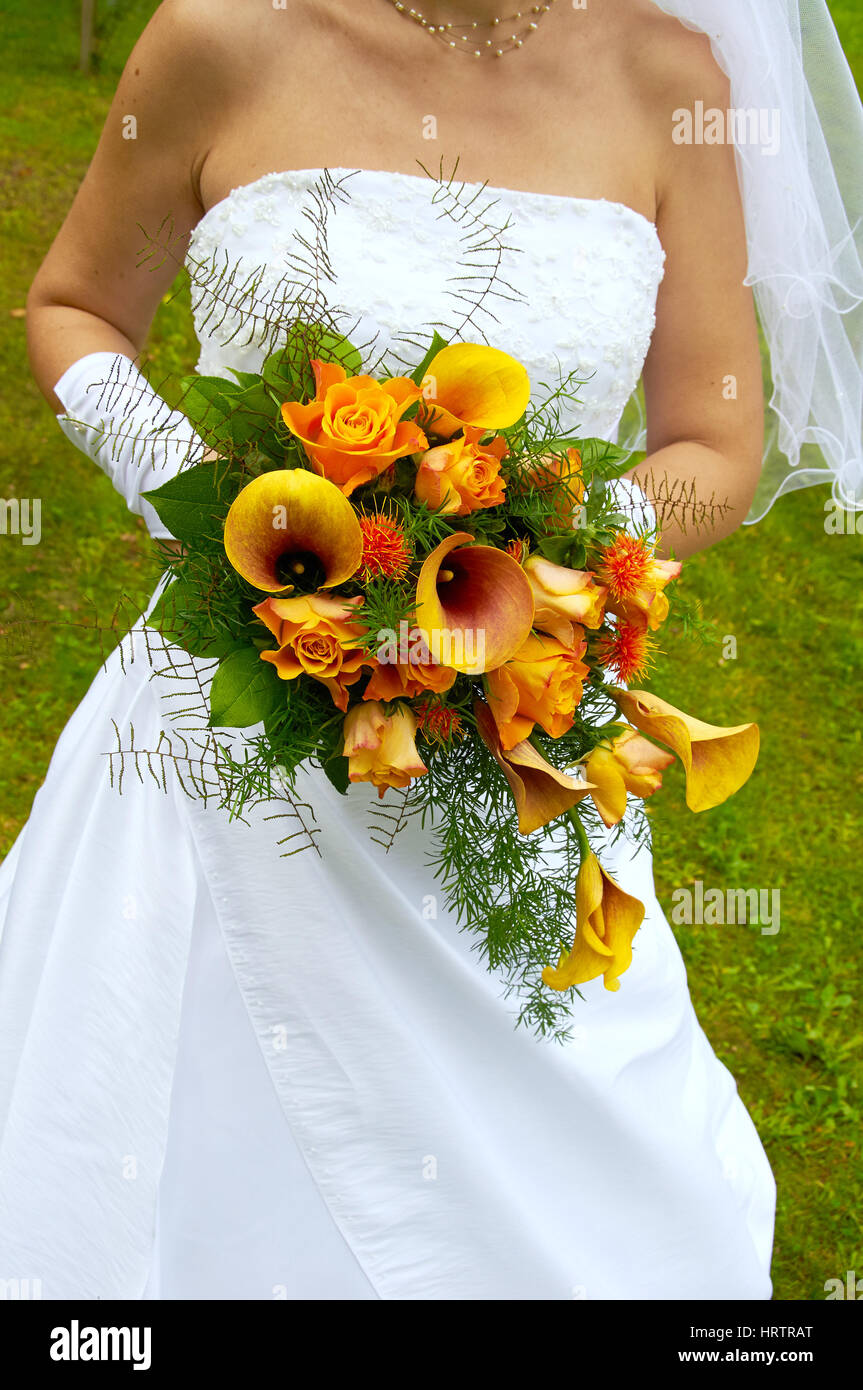 bride holding wedding bouquet with roses Stock Photo - Alamy
