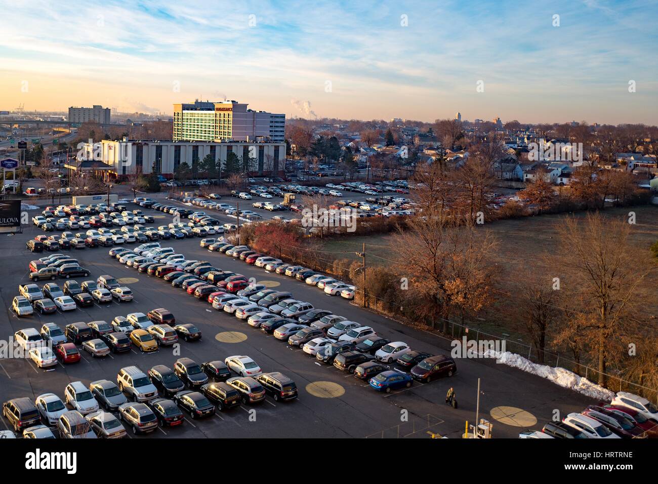 Cars are parked in a lot near Newark Liberty International Airport