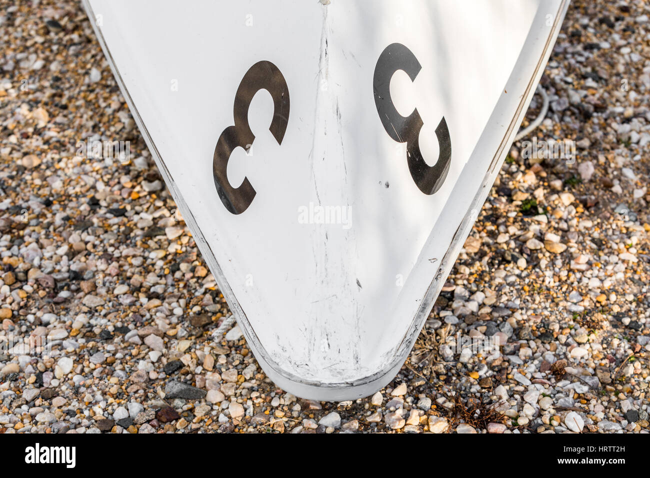 bow of a small white boat with the number 3 on each side Stock Photo