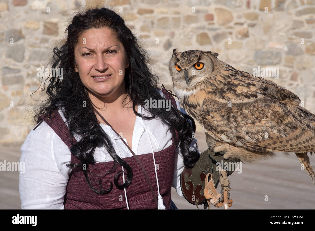Falconry display at the medieval festival with various birds of prey in the historic city of Taggia in Liguria region of Italy Stock Photo