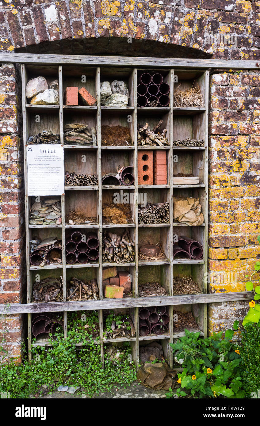 An Insect hotel for bees and bugs built into the brick wall of a house ...