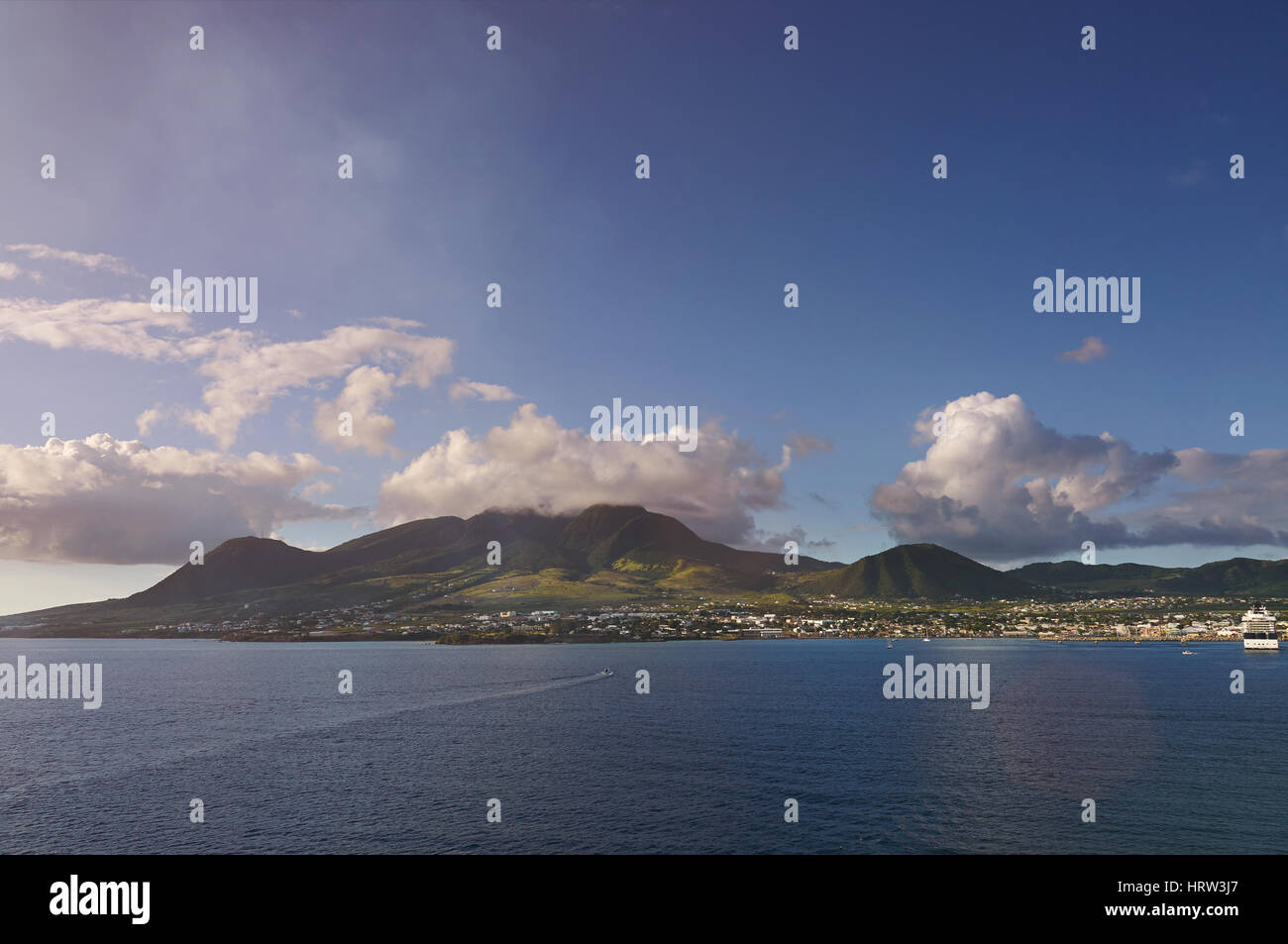 Panorama of St kitts island view from sea. Landscape of caribbean island on sunny day Stock Photo