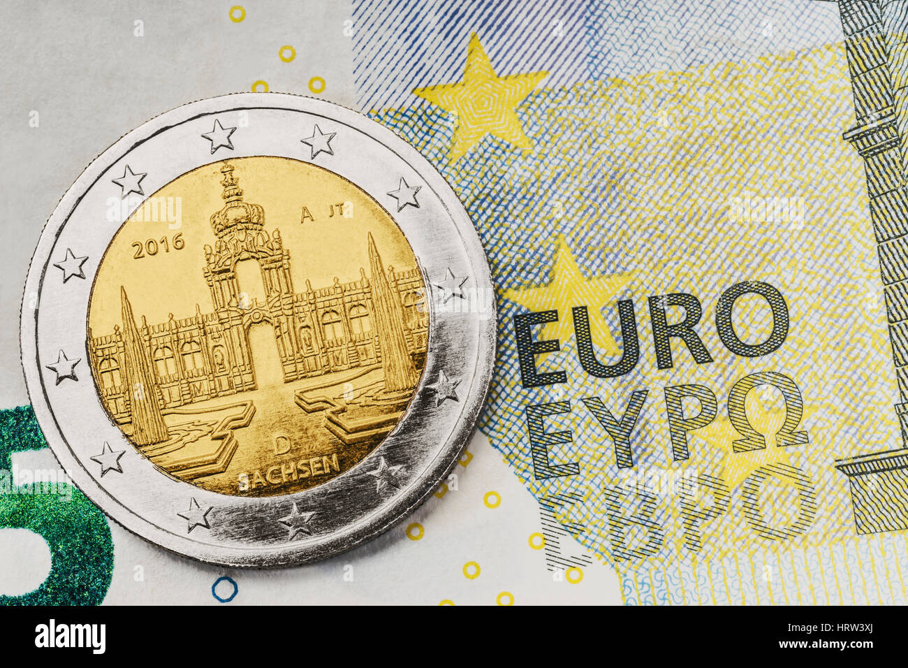 a 2 euro commemorative coin from Germany with the Dresden Zwinger on 5 euro banknote Stock Photo